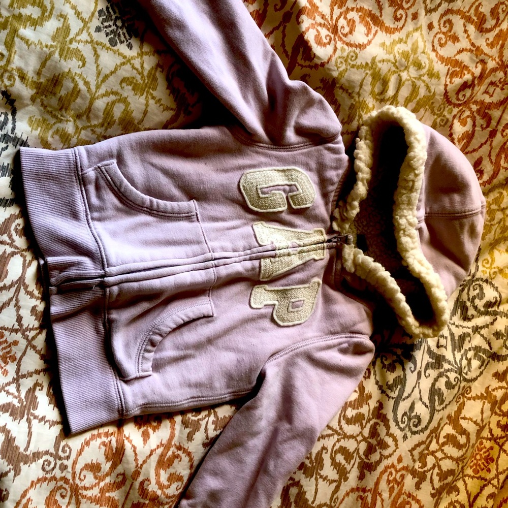 Gently used fleece lined warm zip up hoodie with pockets. Sequin GAP letters.
